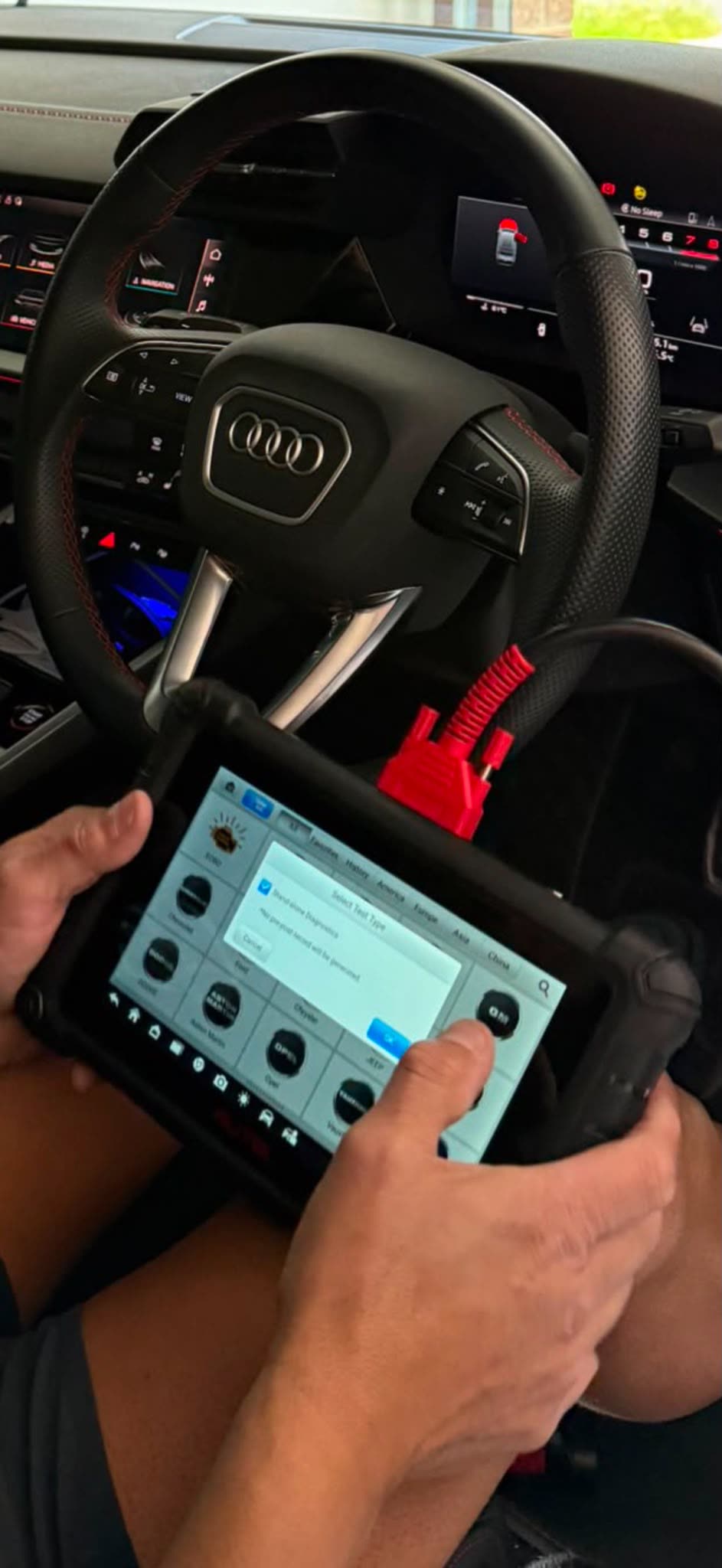 Diagnostic tablet connected to a vehicle